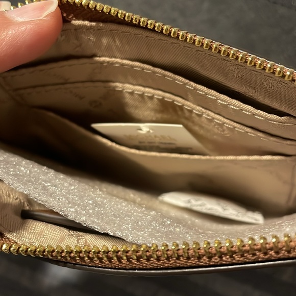 $50 EACH Michael Kors wristlet. Available in black, pink, and brown. - Picture 3 of 5